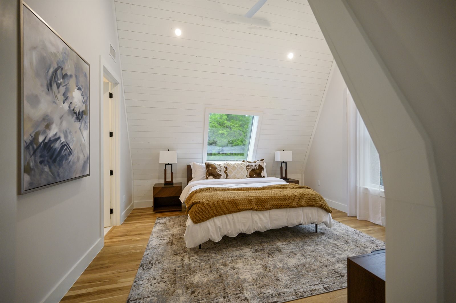 Primary bedroom with an A-frame wall